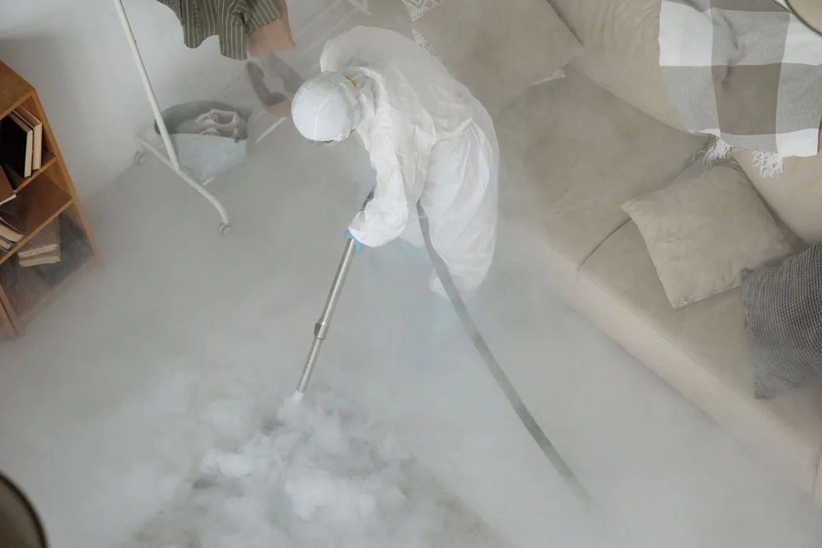 Biohazard cleanup technician in protective equipment, West Elmira, NY